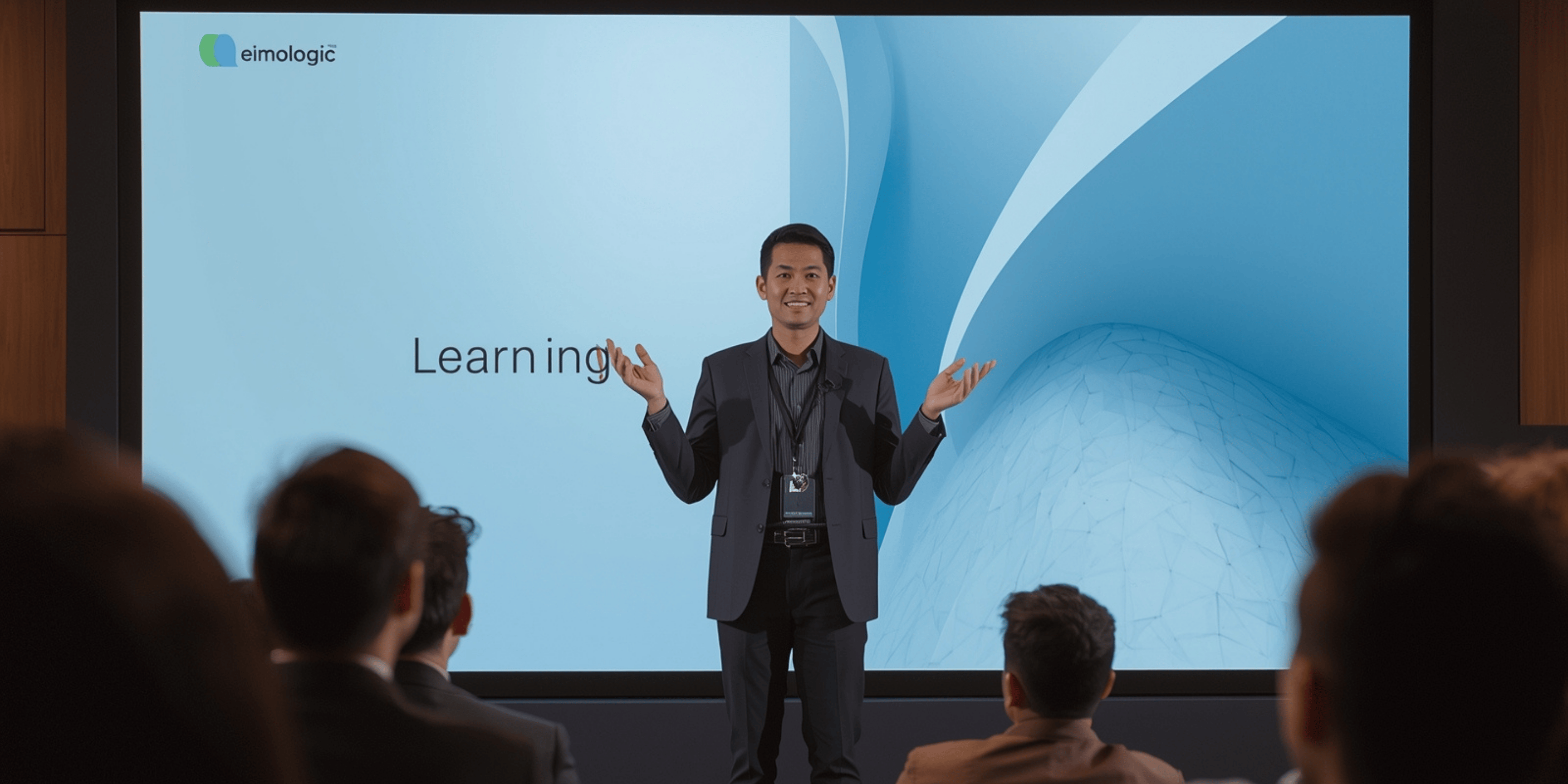 Presenter sedang menjelaskan slide presentasi digital modern di depan layar besar.